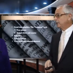 Man talking to woman about newsletters.