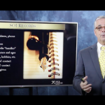 Man in front of television doing a presentation.